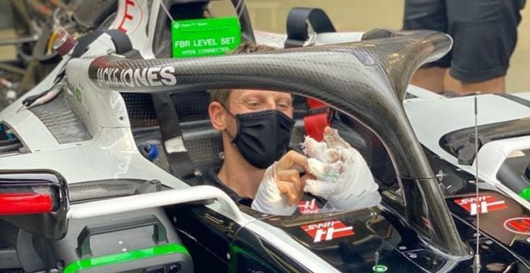Mask can't hide Grosjean's grin as he steps back into the Haas